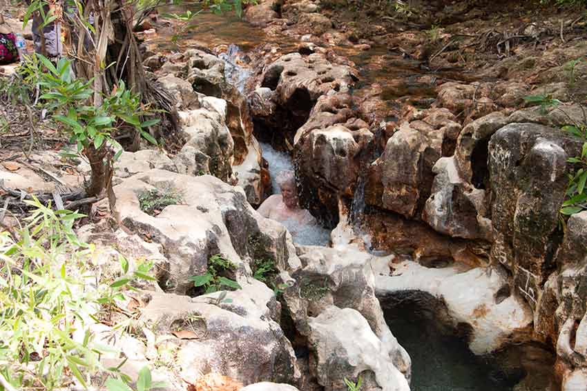 Swimming in the fast-flowing narrow creek at Goanna Lagoon, East Arnhem Land